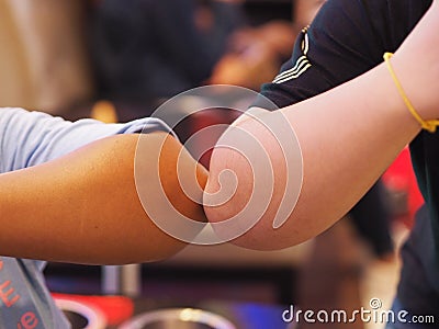 Two woman Alternative handshakes Elbow Bump greeting in the situation of an epidemic covid 19, coronavirus Stock Photo