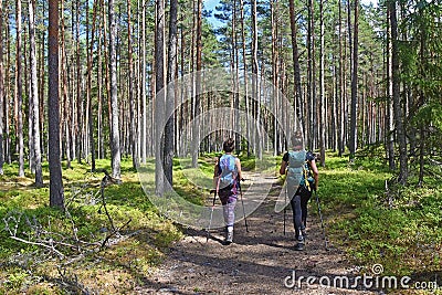 Two Women With Backpacks Trekking On Forest Path Editorial Stock Photo