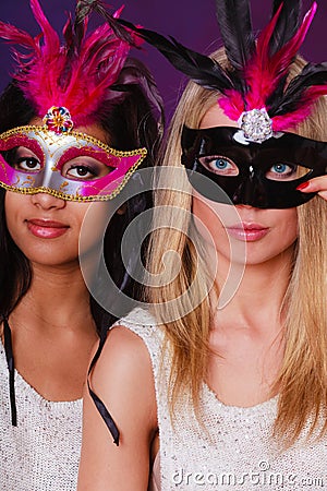 Two women with carnival venetian masks Stock Photo