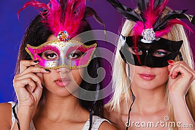 Two women with carnival venetian masks Stock Photo