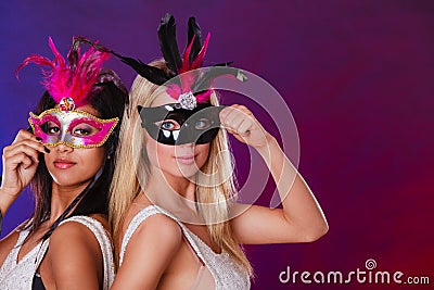 Two women with carnival venetian masks Stock Photo