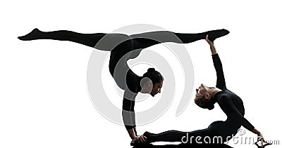 Two women contortionist exercising gymnastic yoga silhouette Stock Photo