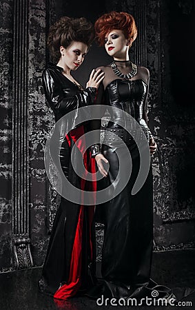 Two women in fetish costumes Stock Photo