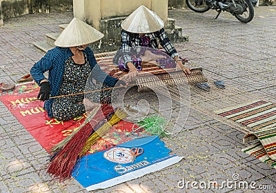 Two Women flat weave carpet in Nha Trang, Vietnam Editorial Stock Photo