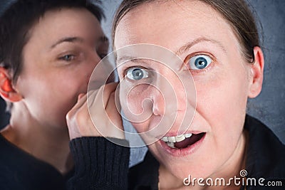 Two women gossiping Stock Photo