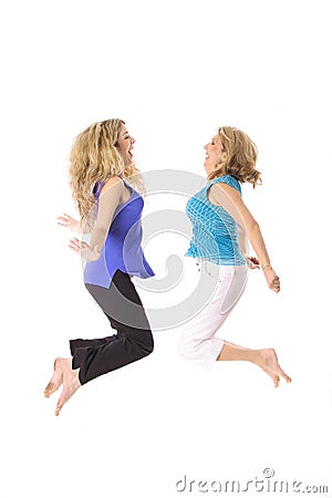 Two women jumping Stock Photo