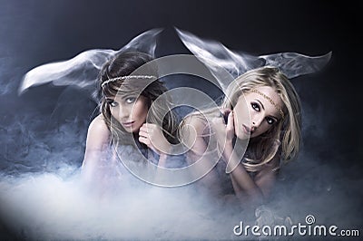 Two women like siren Stock Photo