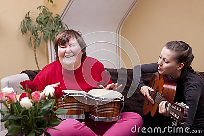 Two women make a music therapy Stock Photo