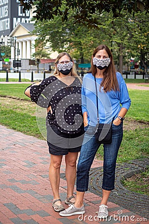 Two women mourners in black face masks with RBG lace trim. Editorial Stock Photo