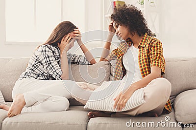 Two women talking about problems at home Stock Photo