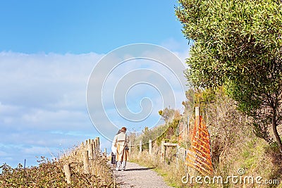 Two Women Walking And Conversing Editorial Stock Photo