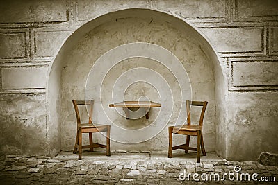 Two wooden chairs and table Stock Photo