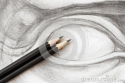 two graphite pencils on drawing of David's eye Stock Photo