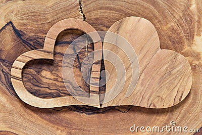 Two wooden hearts on a wooden background Stock Photo