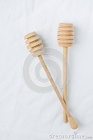 Two Wooden Honey Dippers Spoon on White Linen Fabric Background Table. Holiday Baking Cooking Workshop Course Announcement Stock Photo