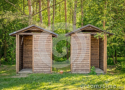 Two wooden huts used as toilets Stock Photo