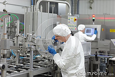 two workers at production line in plant Stock Photo