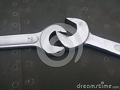 Two wrenches wrestling each other Stock Photo