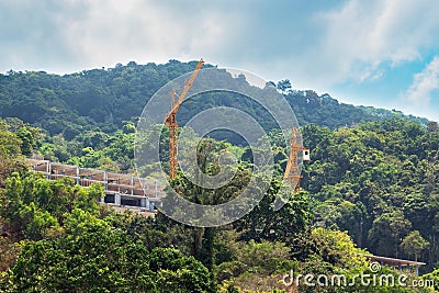 Two yellow building cranes.Industrial construction Stock Photo