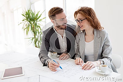 Two young architects working together in office Stock Photo