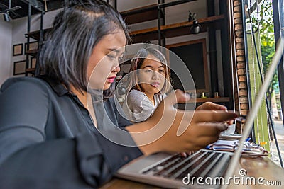 Two young Asian woman freelancers working on laptop Stock Photo