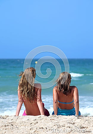 Two young attractive women chilling in the sun on holiday or vac Stock Photo