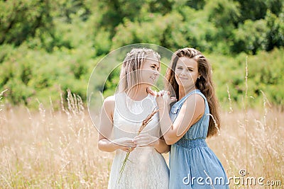 Two young beautiful cheerful girls Stock Photo