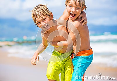 Two young boys having fun on tropcial beach Stock Photo