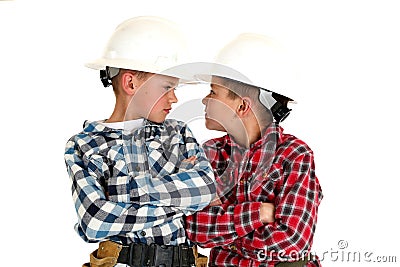 Two young brothers sneering at each other wearing Stock Photo