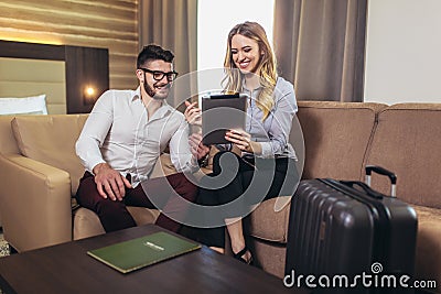 Young business colleagues working on some business ideas in hotel room Stock Photo