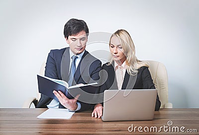 Two young business partners at meeting Stock Photo