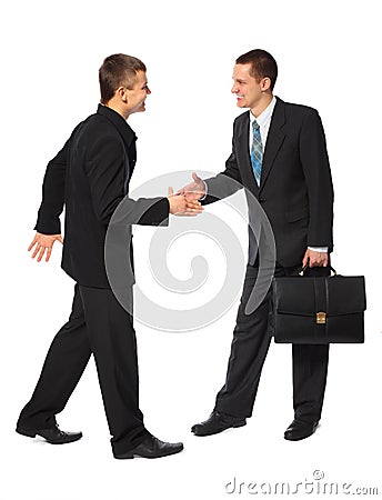 Two young businessmen greet Stock Photo