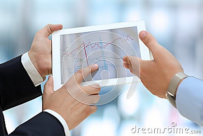 two young businessmen using touchpad Stock Photo