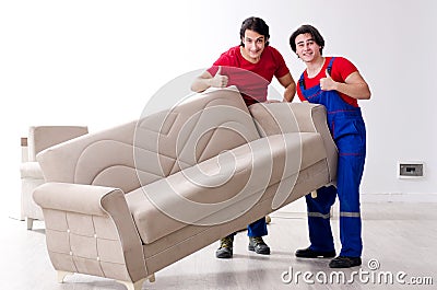 Two young contractor employees moving personal belongings Stock Photo