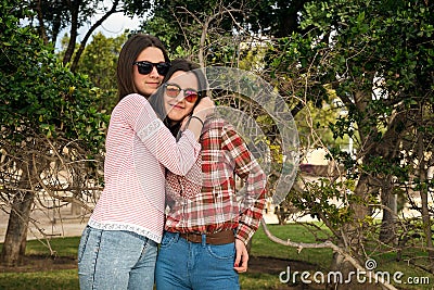 Two young girls in park Stock Photo