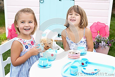 Two young girls play outdoors Stock Photo