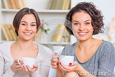 Two young ladies are having tea time Stock Photo