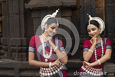 Two Young odissi female artists at Mukteshvara Temple,Bhubaneswar, Odisha, India Stock Photo