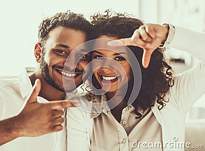 Two Young Pakistani People Framing with Fingers. Stock Photo