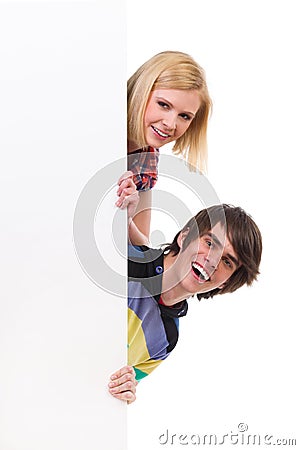 Two young people peeking Stock Photo