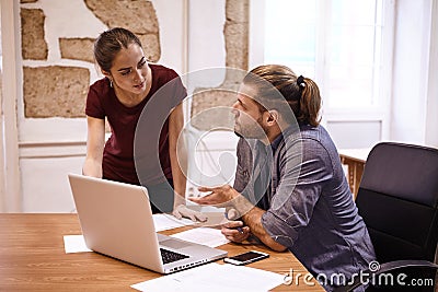 Two young professionals in a discussion Stock Photo