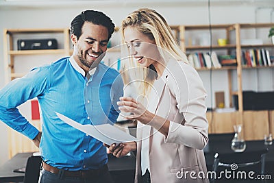 Two young professionals making a great business discussion in modern office.Successful confident hispanic businessman Stock Photo