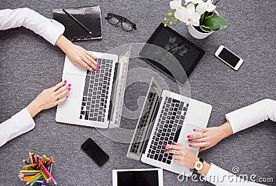 Two young professionals working with computer, view from above Stock Photo