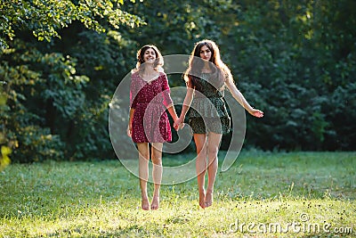 Two young smiling women levitate Stock Photo