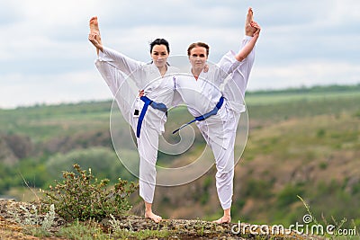 Two young woman doing a synchronised workout Stock Photo