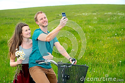 Twosome on bicycle Stock Photo