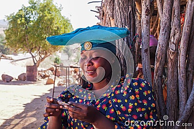 Twyfelfontein, Namibia - Jul 10, 2019: Herero Woman in traditional clothes in Twyfelfontein. Namibia Editorial Stock Photo