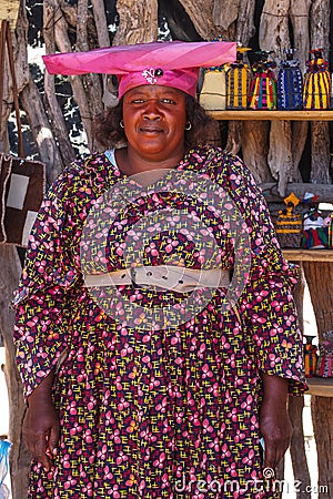 Twyfelfontein, Namibia - Jul 10, 2019: Herero Woman in traditional clothes in Twyfelfontein. Namibia Editorial Stock Photo