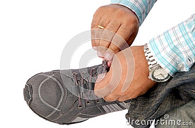 Tying sport shoe laces Stock Photo