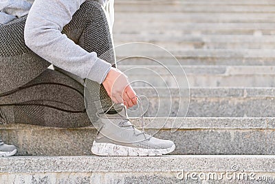 Tying sports shoe Stock Photo